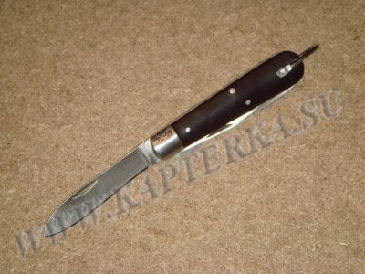 Нож электрика (связиста, сапера)  армии США. TL-29, образца 1929 года. Длина рукояти 90 мм, длина лезвия 65 мм. Особенностью ножа электрика является конструкция  с расположенными на одной оси двумя инструментами: ножом и плоской отверткой, имеющую одну за